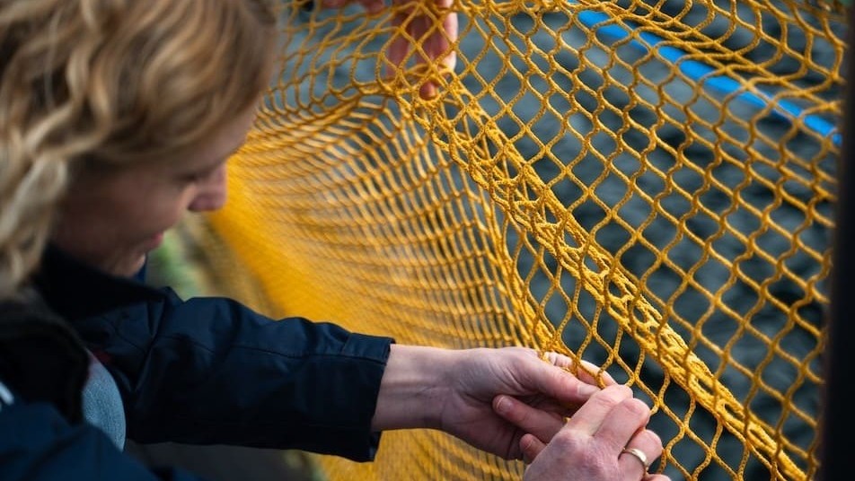 1 People Employee working with fishing nets